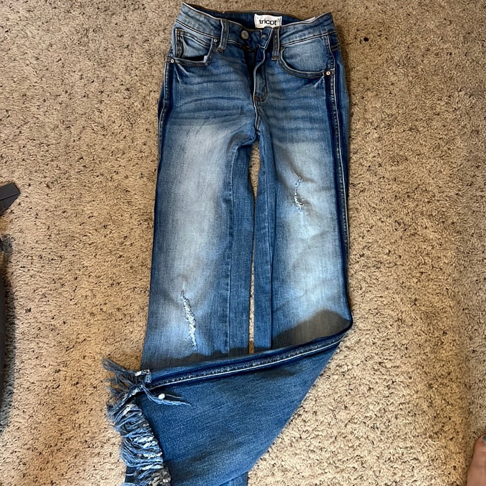 Distressed hem jeans